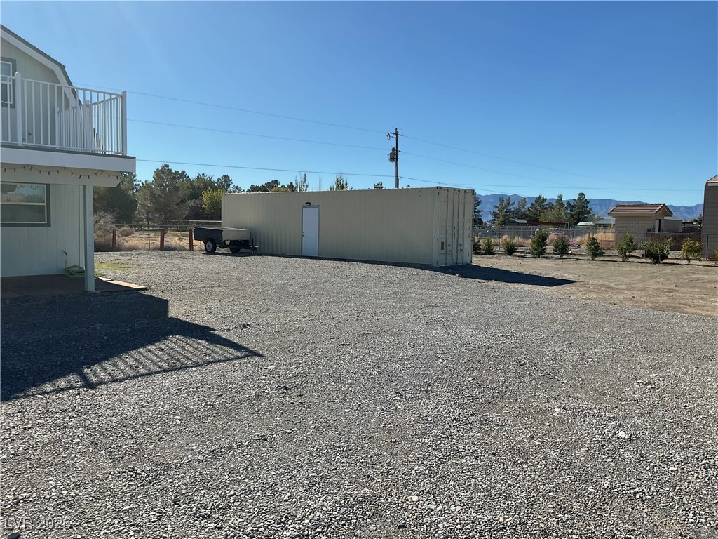5261 East Kellogg Road Pahrump, NV 89061 - Photo 2 of 28 A portion of the 2.2 acres showing the storage container.