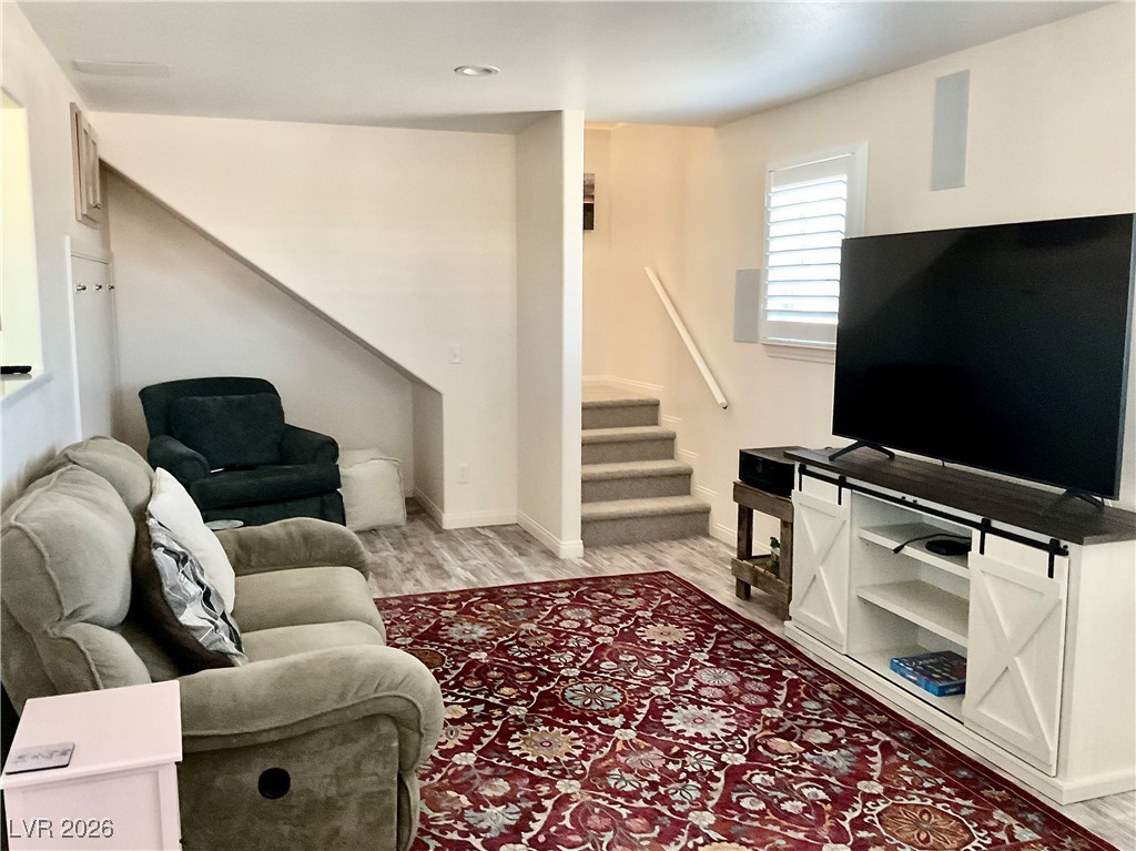 5261 East Kellogg Road Pahrump, NV 89061 - Photo 5 of 28 Living room with access to the staircase leading to the Owner's Retreat