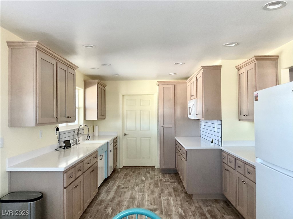 5261 East Kellogg Road Pahrump, NV 89061 - Photo 10 of 28 Kitchen complete with soft close cabinet doors and drawers. All the lower cabinets have pullout shelves all with access to the Laundry Room