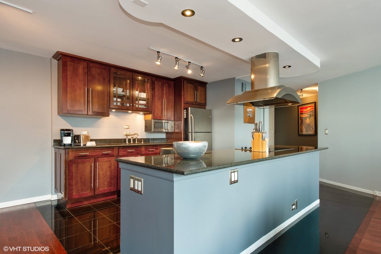 505 North Lake Shore Drive, Unit 1518 Chicago, IL 60611 - Photo 4 of 28 a kitchen with stainless steel appliances granite countertop a sink a stove and a refrigerator