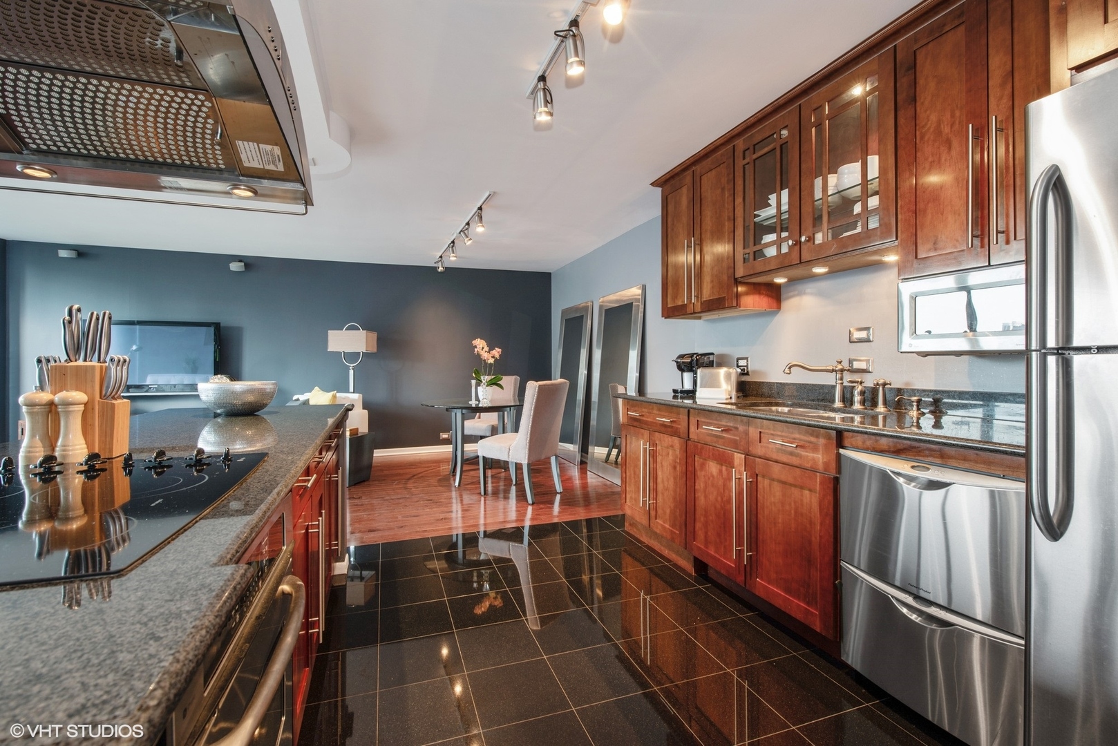 505 North Lake Shore Drive, Unit 1518 Chicago, IL 60611 - Photo 5 of 28 a kitchen with stainless steel appliances granite countertop a sink and cabinets