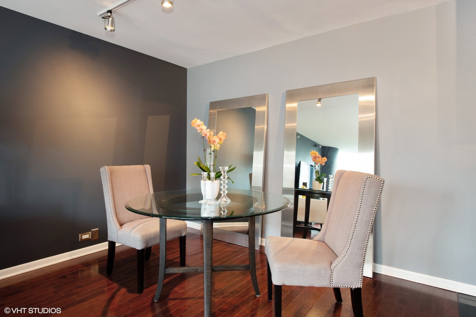 505 North Lake Shore Drive, Unit 1518 Chicago, IL 60611 - Photo 8 of 28 a dining room with furniture and wooden floor