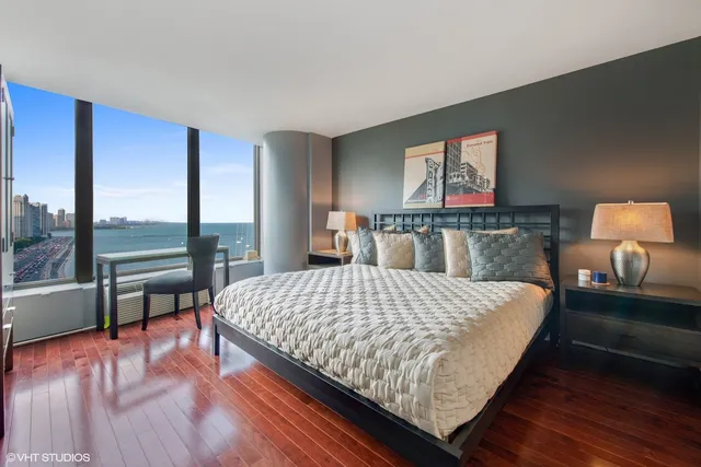 a bedroom with a large bed and a balcony