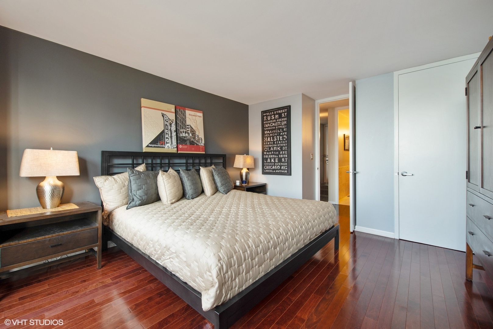 505 North Lake Shore Drive, Unit 1518 Chicago, IL 60611 - Photo 10 of 28 a bedroom with a bed and wooden floor
