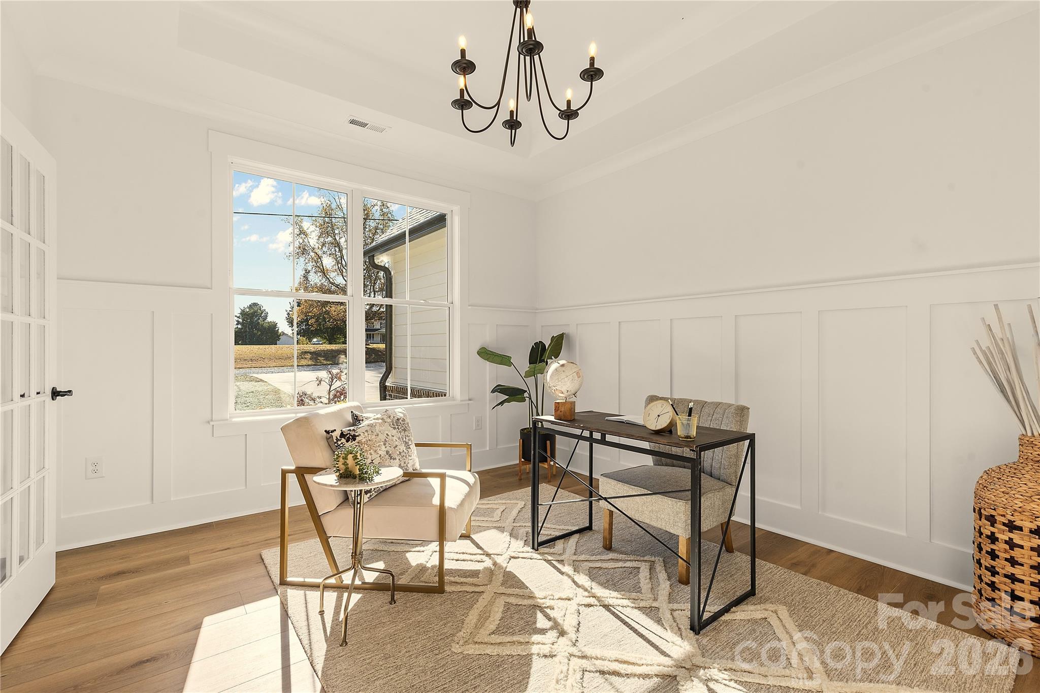 9729 Flowes Store Road Midland, NC 28107 - Photo 14 of 29 a view of a dining room with furniture and wooden floor