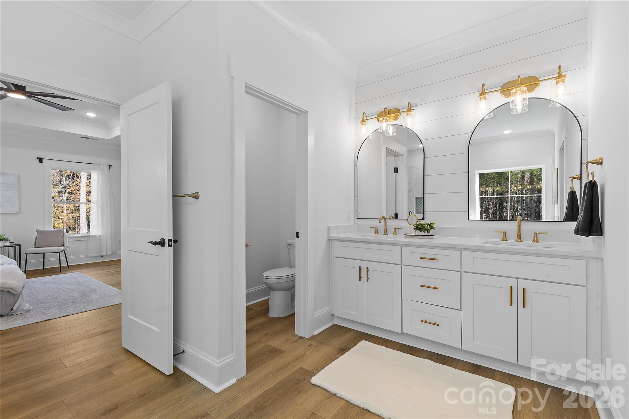 9729 Flowes Store Road Midland, NC 28107 - Photo 22 of 29 a spacious bathroom with a granite countertop sink mirror and a