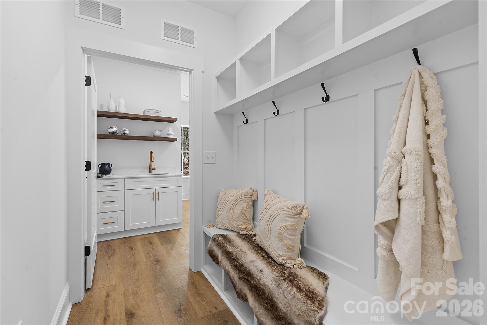 9729 Flowes Store Road Midland, NC 28107 - Photo 24 of 29 a walk in closet with wooden floor