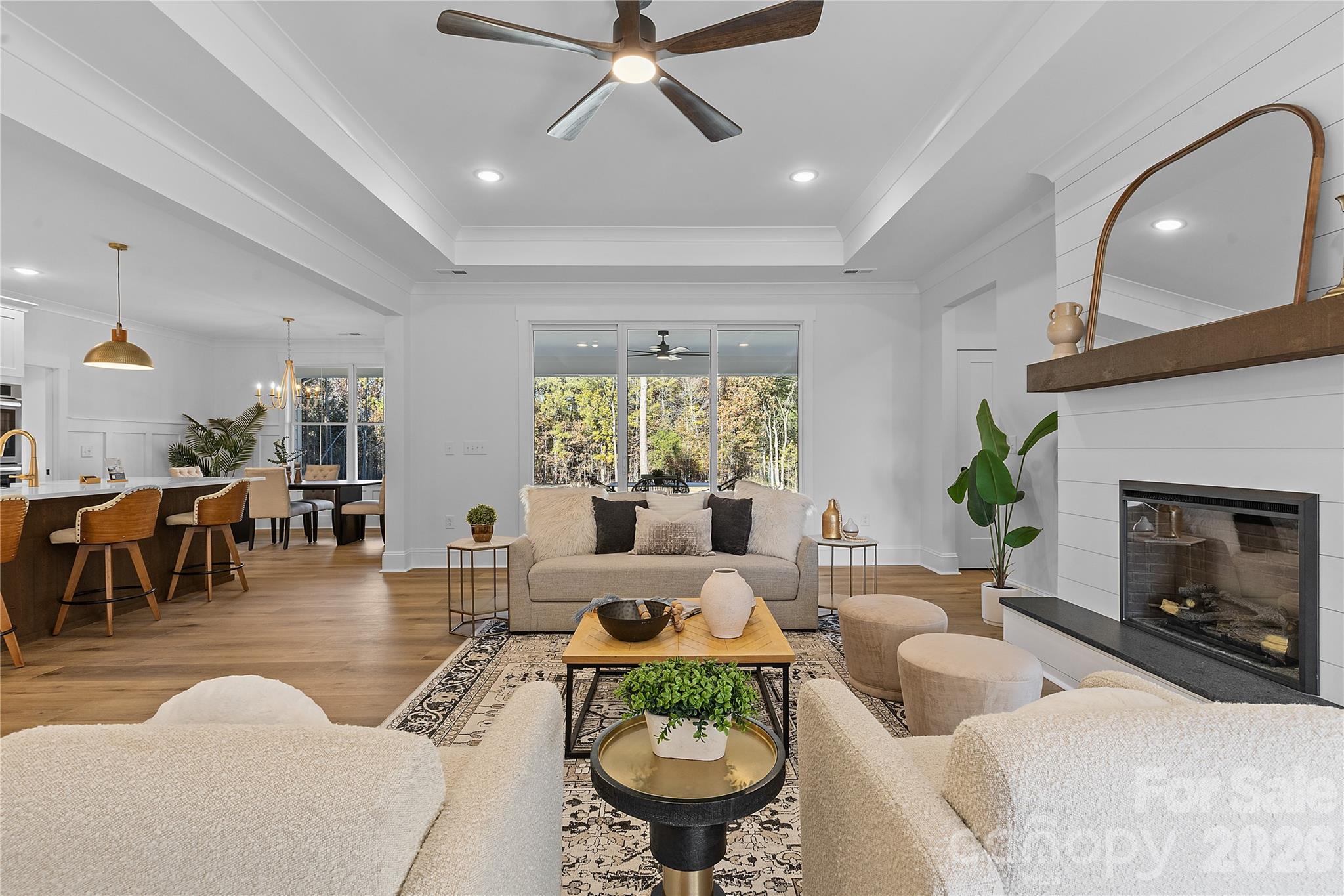 9729 Flowes Store Road Midland, NC 28107 - Photo 26 of 29 a living room with furniture and a fireplace