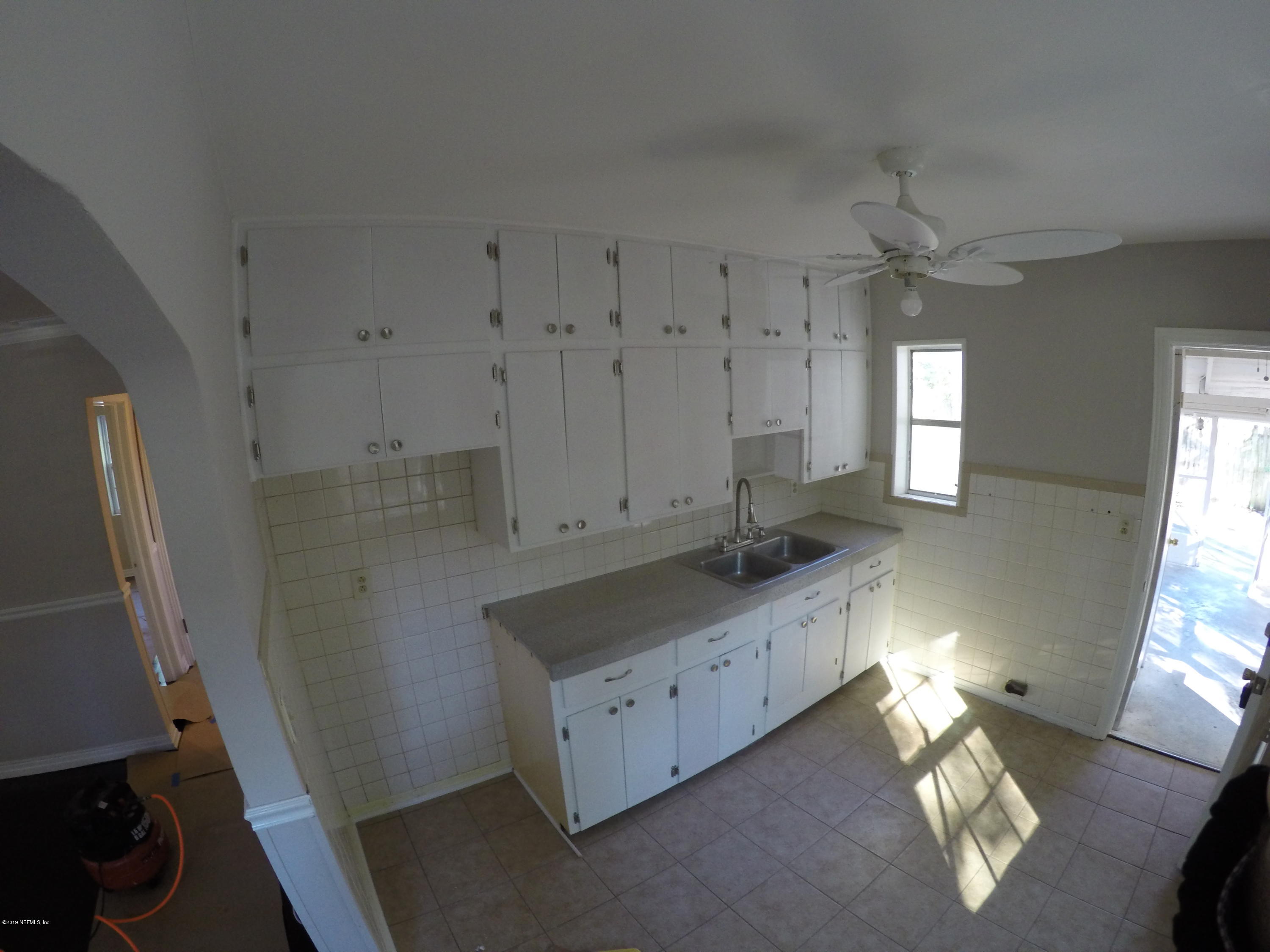 1043 Seba Street Jacksonville, FL 32205 - Photo 3 of 5 a bathroom with double vanity sink and a mirror