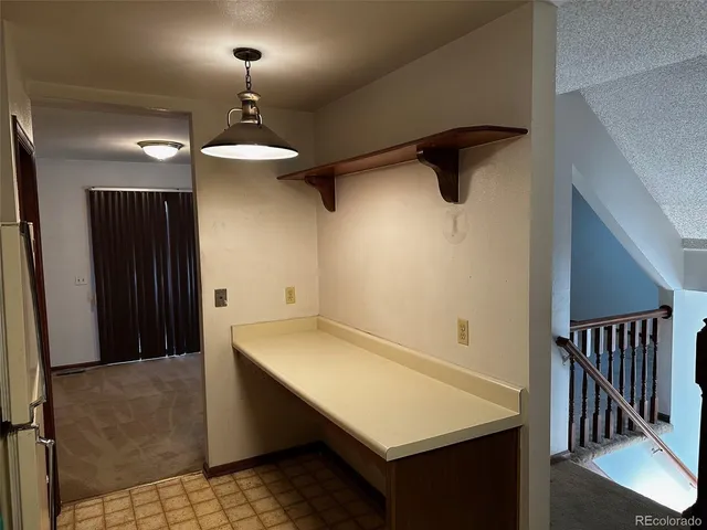 a view of a hallway with seating area