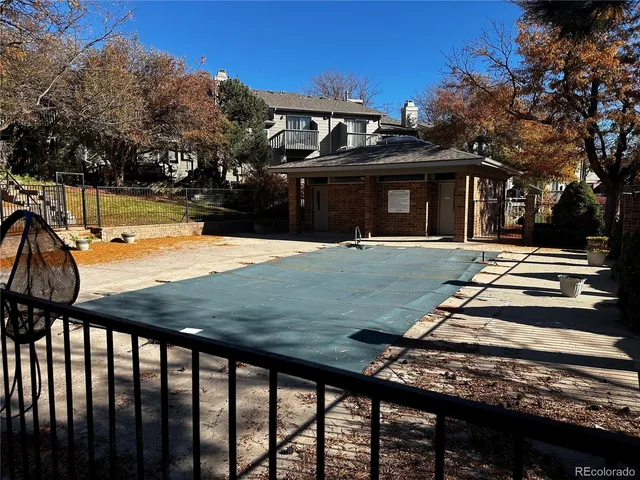 a view of a house with street next to a road