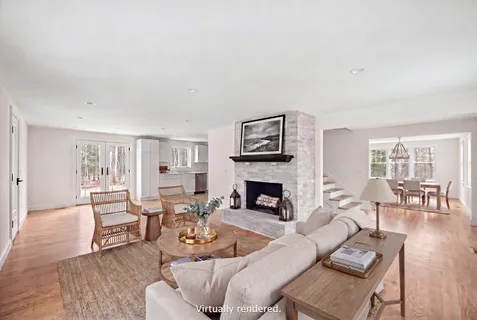a large kitchen with stainless steel appliances granite countertop a stove a sink and a refrigerator