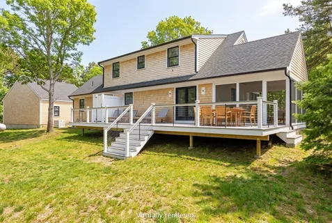 a house with yard in front of it