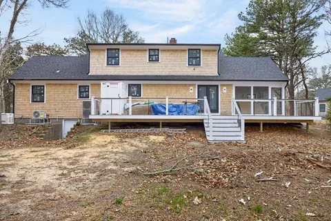 a view of backyard of a house