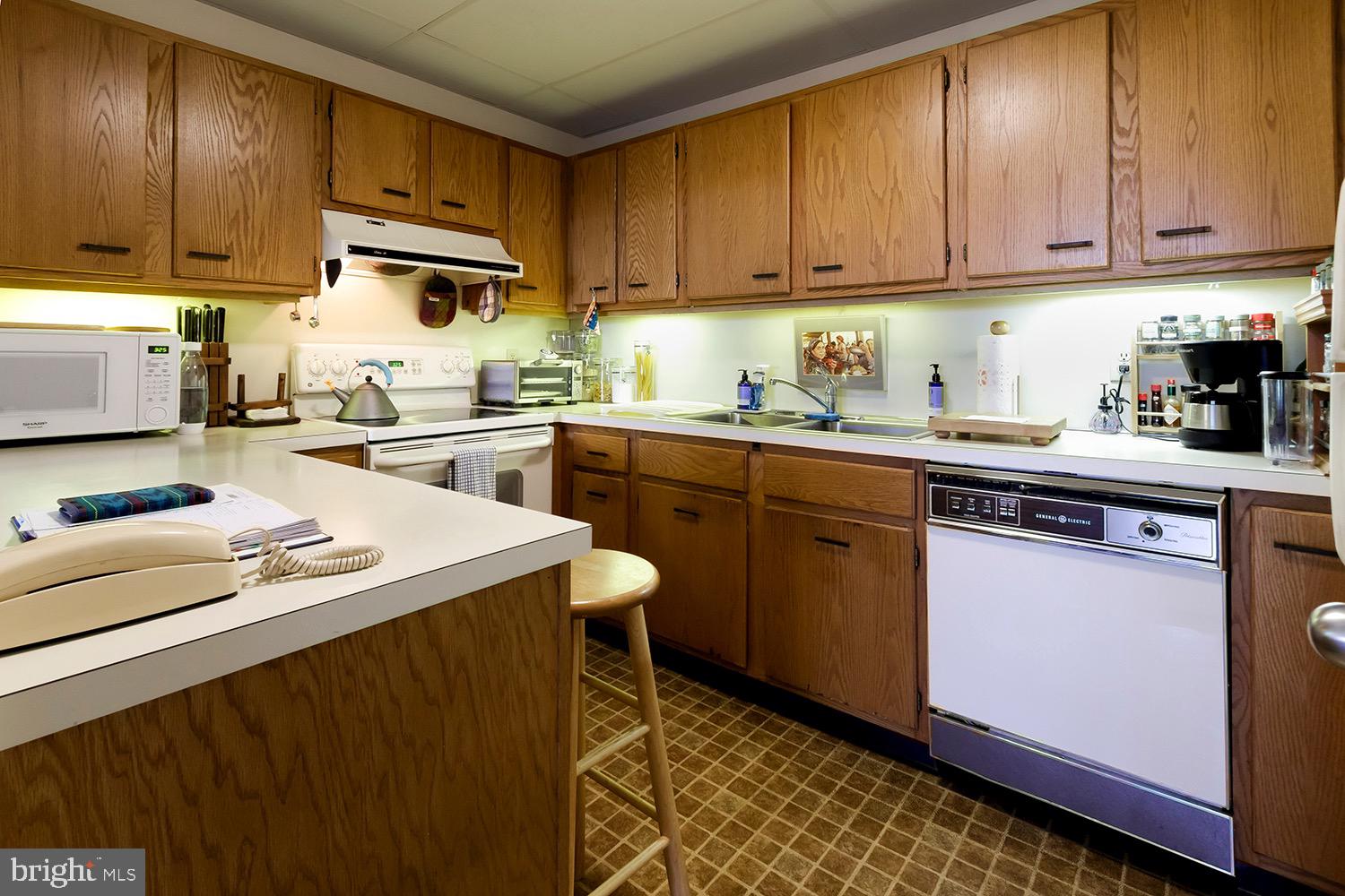 1 Markham Road, Unit 2B Princeton, NJ 08540 - Photo 12 of 19 a kitchen with a sink a stove and cabinets