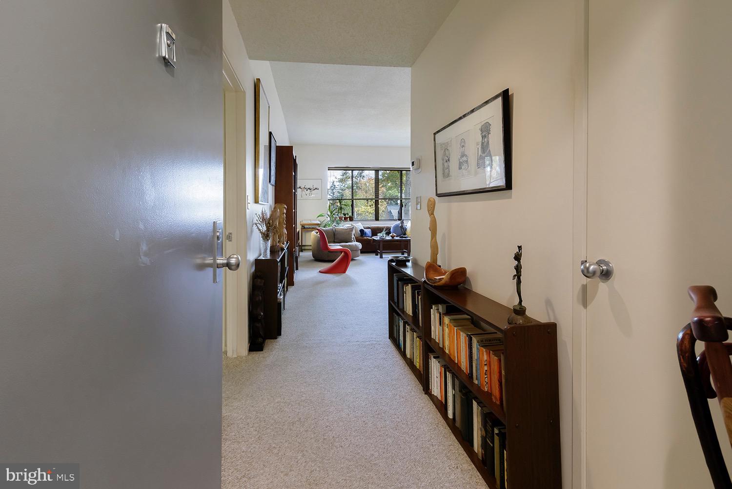 1 Markham Road, Unit 2B Princeton, NJ 08540 - Photo 7 of 19 a view of a hallway to a livingroom with furniture