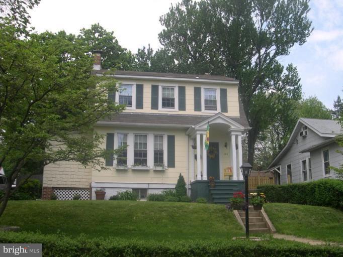 1100 Overbrook Road Baltimore, MD 21239 - Photo 1 of 23 a front view of a house with a yard