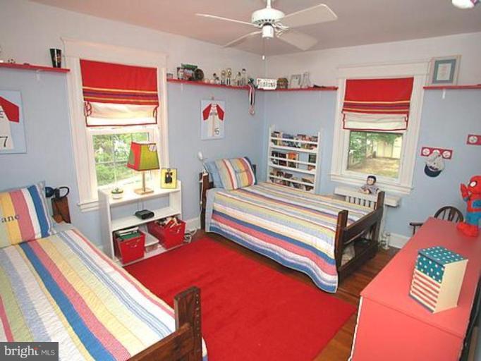 1100 Overbrook Road Baltimore, MD 21239 - Photo 15 of 23 a bedroom with furniture and a window