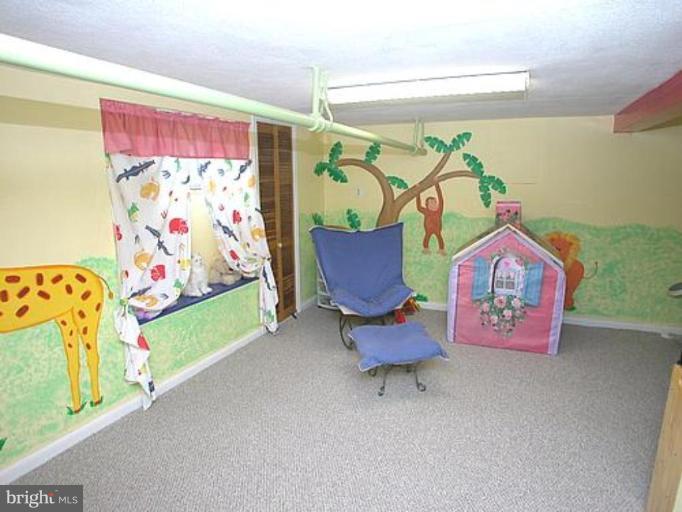1100 Overbrook Road Baltimore, MD 21239 - Photo 18 of 23 a bedroom with furniture and a bed