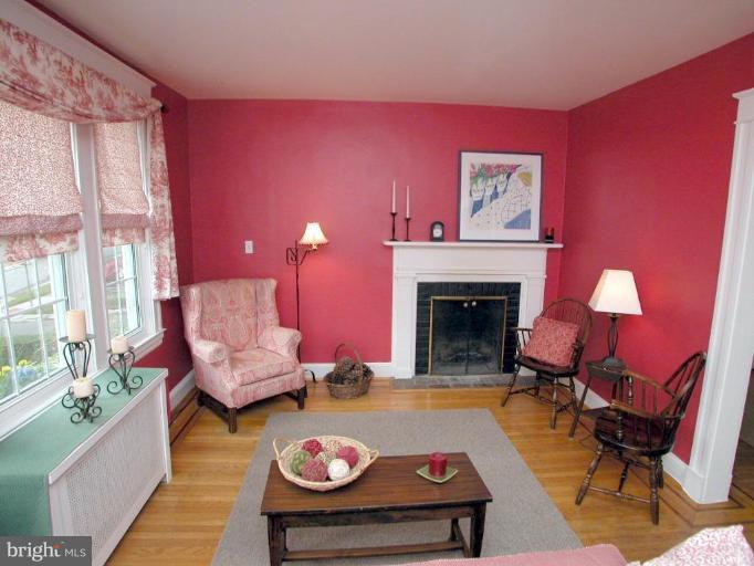 1100 Overbrook Road Baltimore, MD 21239 - Photo 3 of 23 a living room with furniture and a fireplace