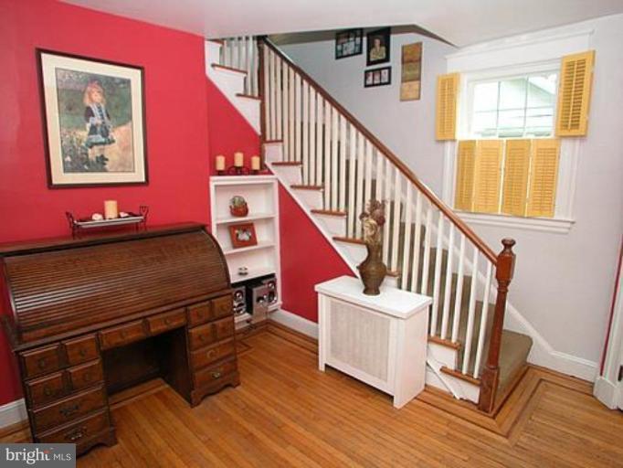 1100 Overbrook Road Baltimore, MD 21239 - Photo 4 of 23 a view of entryway with wooden floor and stairs