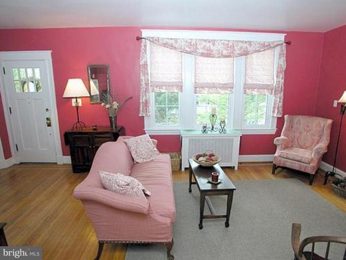 1100 Overbrook Road Baltimore, MD 21239 - Photo 5 of 23 a living room with furniture and a large window