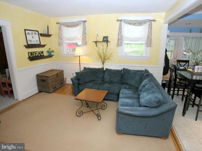 1100 Overbrook Road Baltimore, MD 21239 - Photo 8 of 23 a living room with furniture and a window
