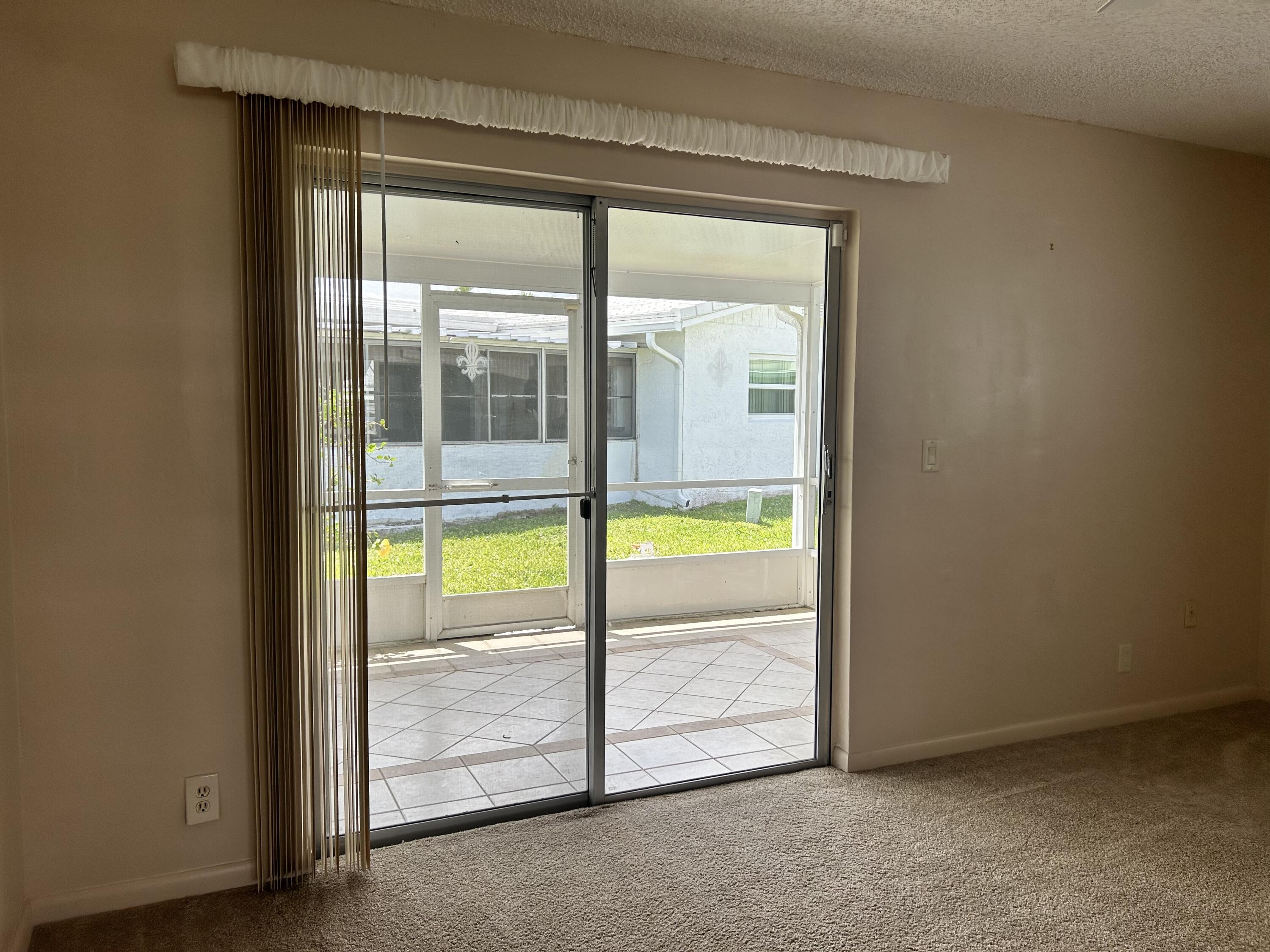 1900 Southwest Roma Way Boynton Beach, FL 33426 - Photo 12 of 33 SLIDER OFF DEN/FAMILY ROOM TO LANAI