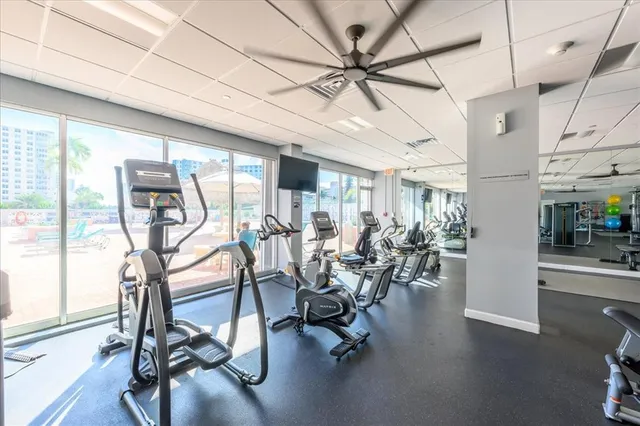 a view of a hall with gym equipment