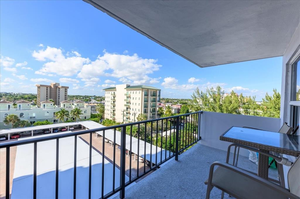 405 North Ocean Boulevard, Unit 611 Pompano Beach, FL 33062 - Photo 19 of 39 a view of a chairs and table in the balcony