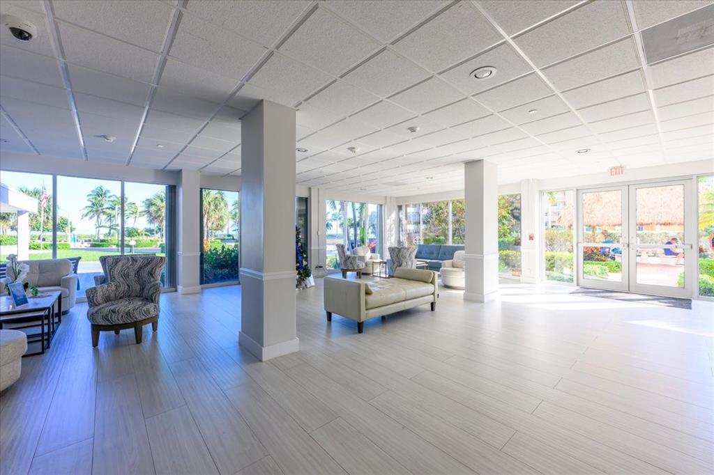405 North Ocean Boulevard, Unit 611 Pompano Beach, FL 33062 - Photo 24 of 39 a living room with furniture and a large window