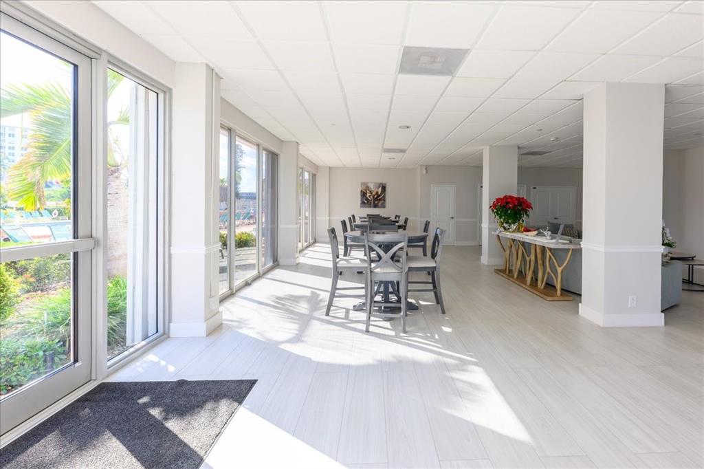 405 North Ocean Boulevard, Unit 611 Pompano Beach, FL 33062 - Photo 26 of 39 a view of a dining room with furniture water view and a large window