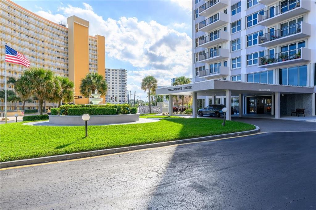 405 North Ocean Boulevard, Unit 611 Pompano Beach, FL 33062 - Photo 28 of 39 a view of a building with a yard
