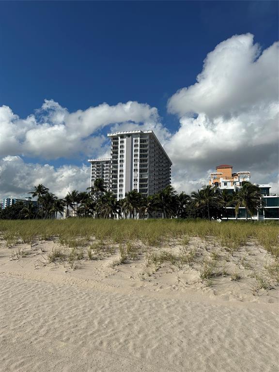405 North Ocean Boulevard, Unit 611 Pompano Beach, FL 33062 - Photo 34 of 39 a view of a lake with a yard