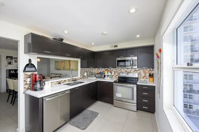 a large kitchen with a window