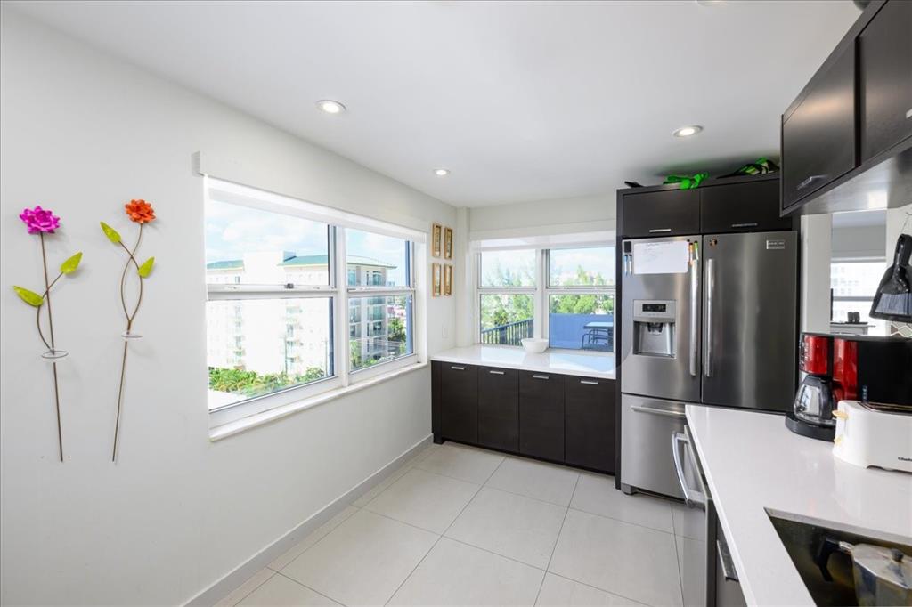 405 North Ocean Boulevard, Unit 611 Pompano Beach, FL 33062 - Photo 5 of 39 a large kitchen with a window