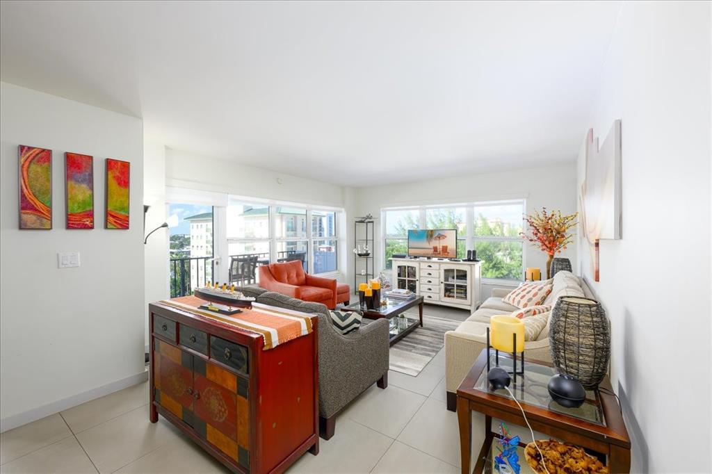 405 North Ocean Boulevard, Unit 611 Pompano Beach, FL 33062 - Photo 6 of 39 a room with furniture water view and a large window