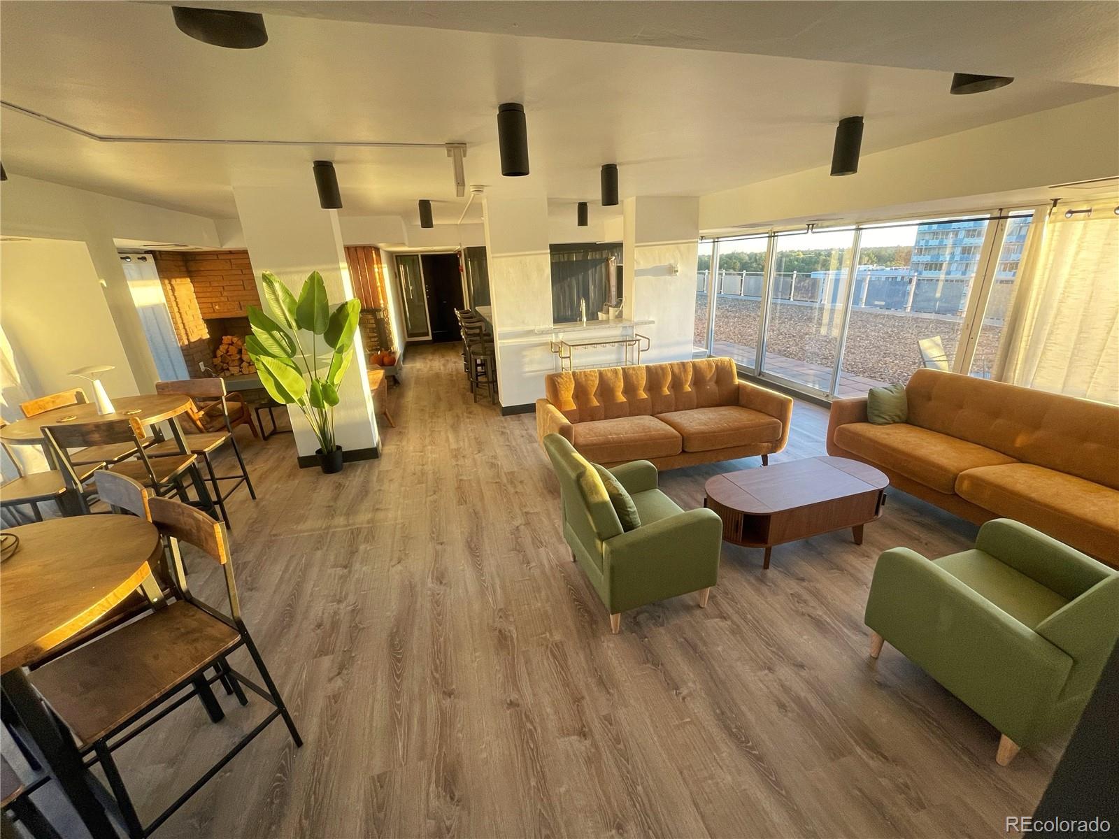 1121 Albion Street, Unit 709 Denver, CO 80220 - Photo 21 of 24 a living room with furniture and a wooden floor