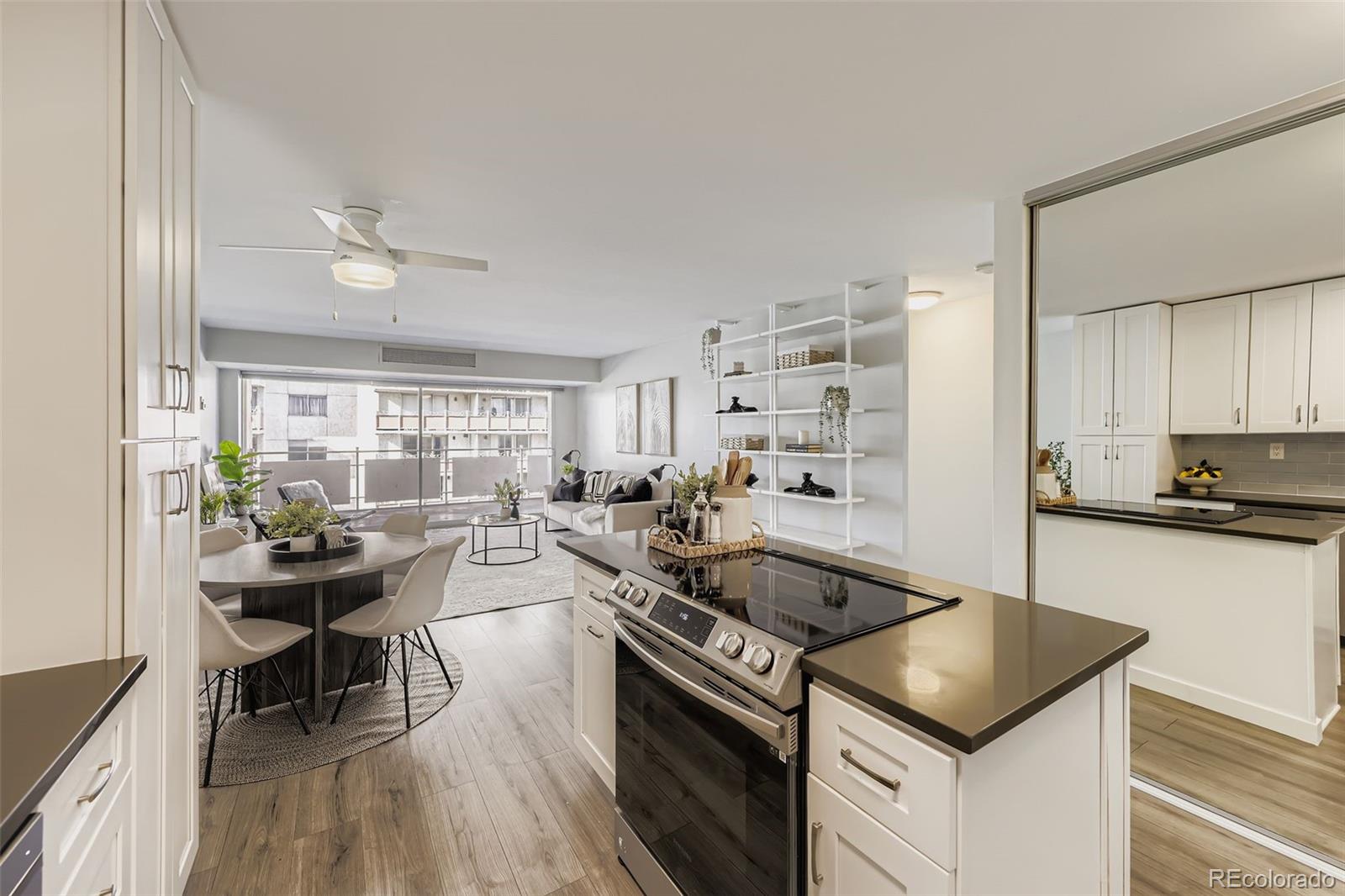 1121 Albion Street, Unit 709 Denver, CO 80220 - Photo 8 of 24 a kitchen with a stove a sink and a refrigerator