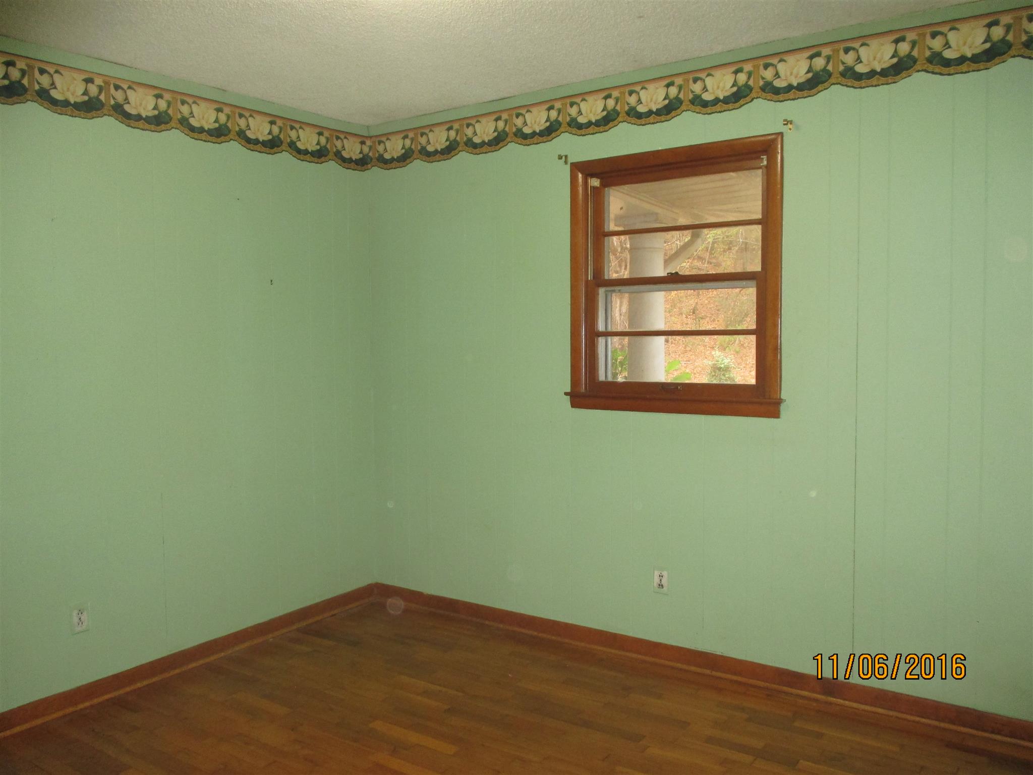 2409 Shores Road Goodspring, TN 38460 - Photo 14 of 21 a view of a small space with wooden floor and a window