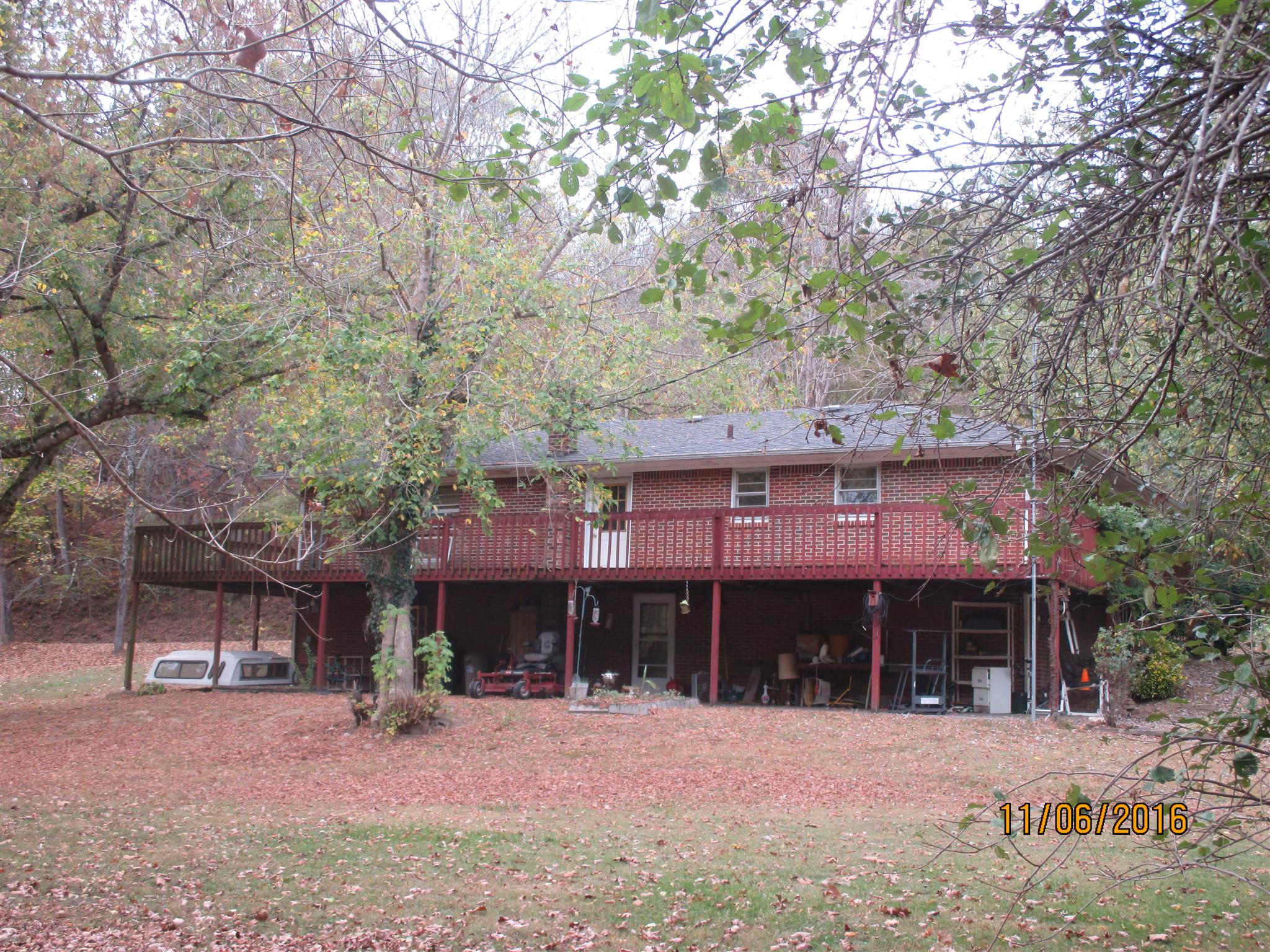 2409 Shores Road Goodspring, TN 38460 - Photo 2 of 21 a front view of a house with a yard and tree