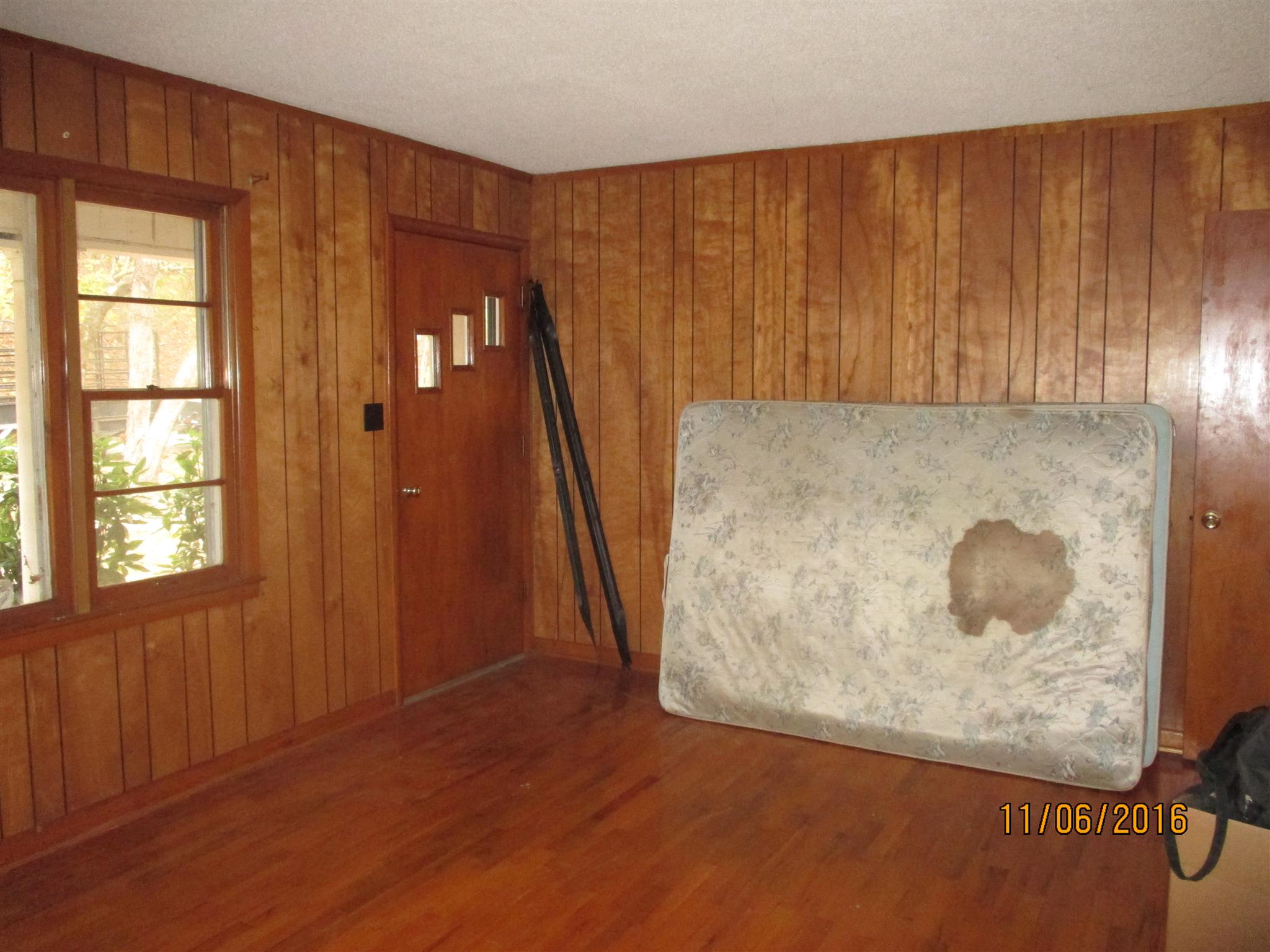2409 Shores Road Goodspring, TN 38460 - Photo 8 of 21 an empty room with wooden floor and windows