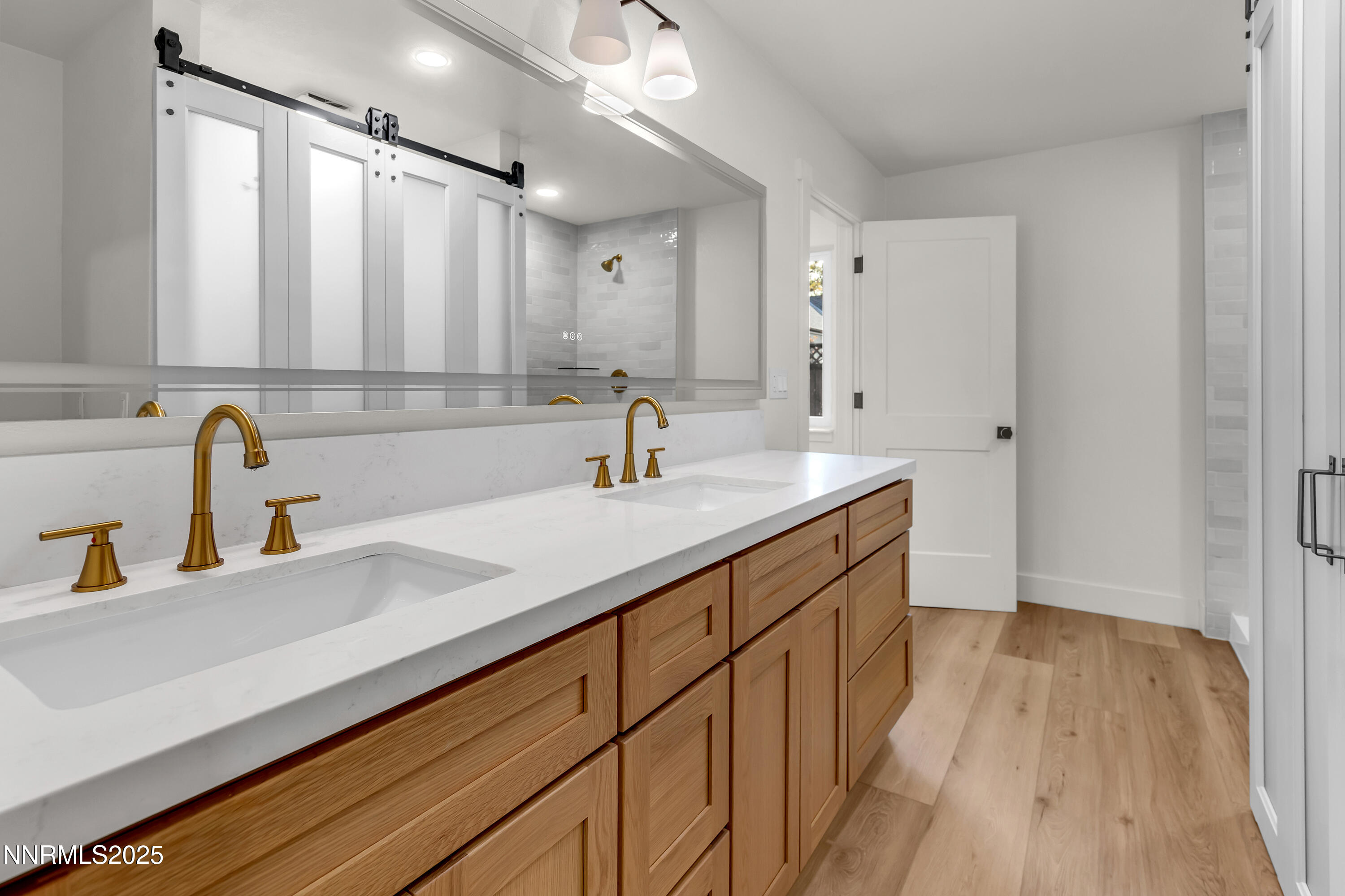 650 John Fremont Drive Reno, NV 89509 - Photo 21 of 37 a bathroom with a sink and a large mirror