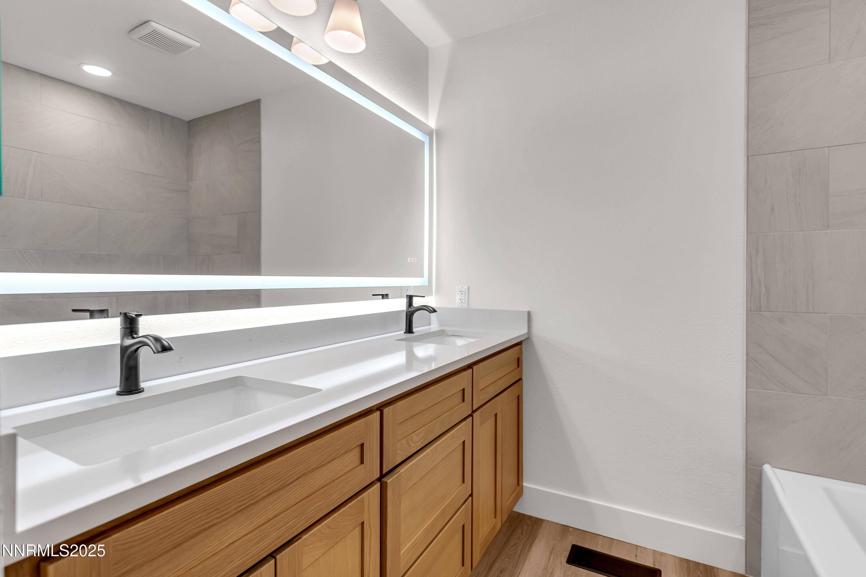 650 John Fremont Drive Reno, NV 89509 - Photo 31 of 37 a bathroom with a sink and a mirror