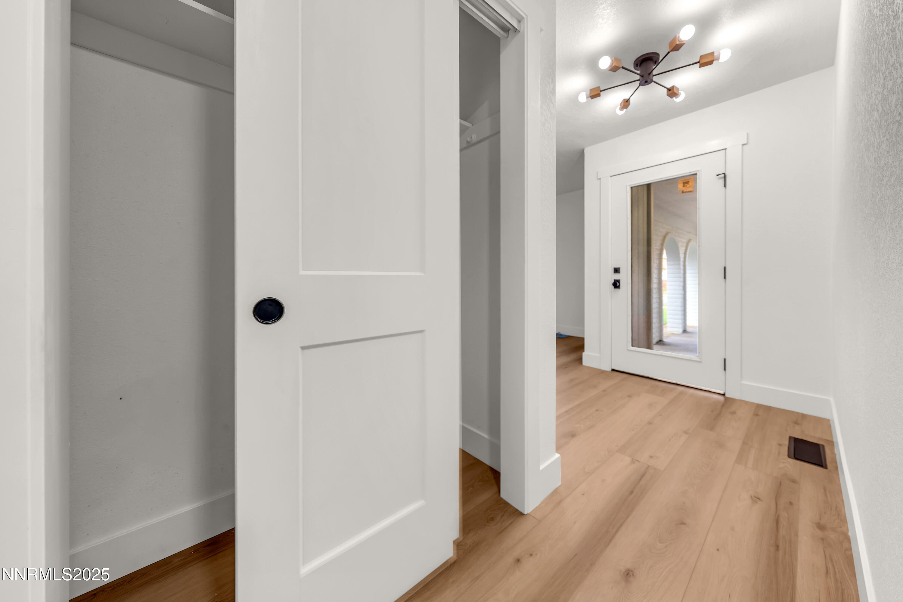 650 John Fremont Drive Reno, NV 89509 - Photo 34 of 37 a view of a hallway with wooden floor and closet