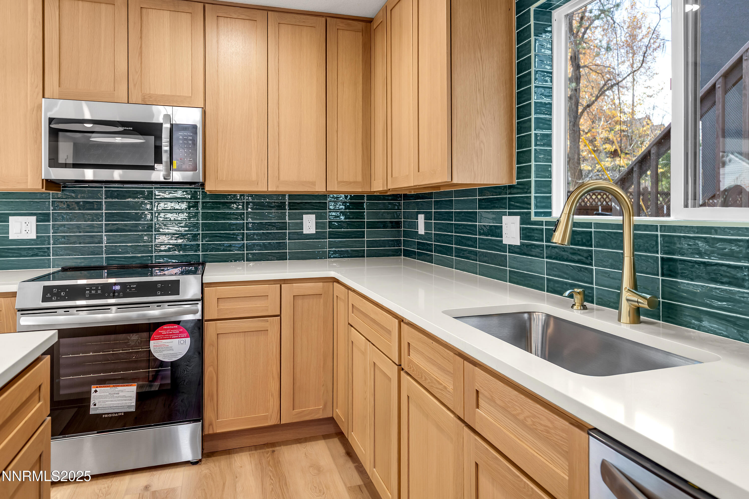 650 John Fremont Drive Reno, NV 89509 - Photo 5 of 37 a kitchen with a sink and a stove top oven