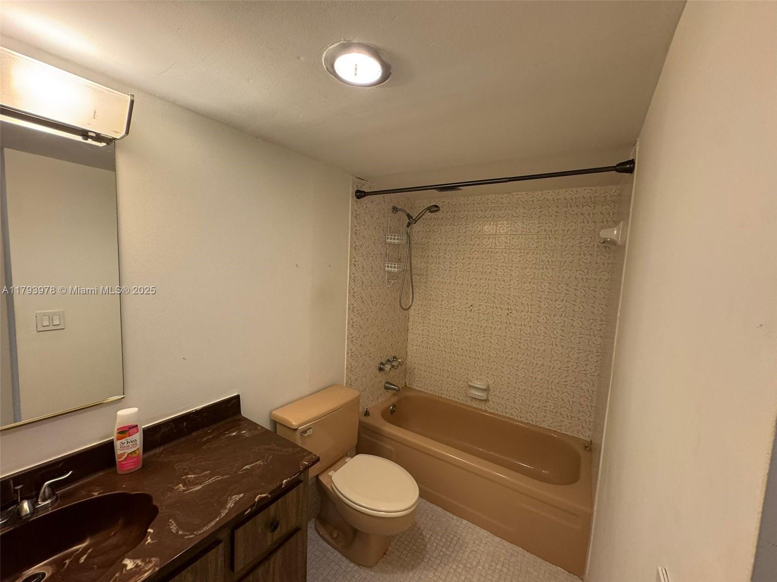 2851 Northeast 183rd Street, Unit 1408E Aventura, FL 33160 - Photo 19 of 24 a bathroom with a granite countertop sink toilet and shower