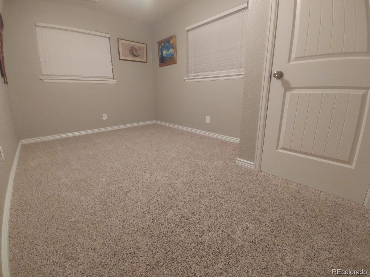 2918 Ames Street Wheat Ridge, CO 80214 - Photo 15 of 19 an empty room with windows