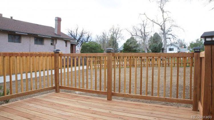 2918 Ames Street Wheat Ridge, CO 80214 - Photo 3 of 19 a view of a wooden fence