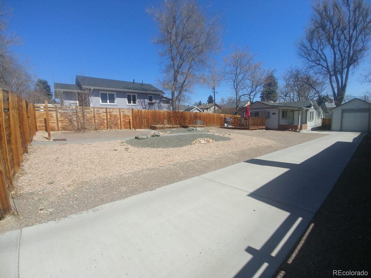 2918 Ames Street Wheat Ridge, CO 80214 - Photo 5 of 19 a view of a house with snow on the road
